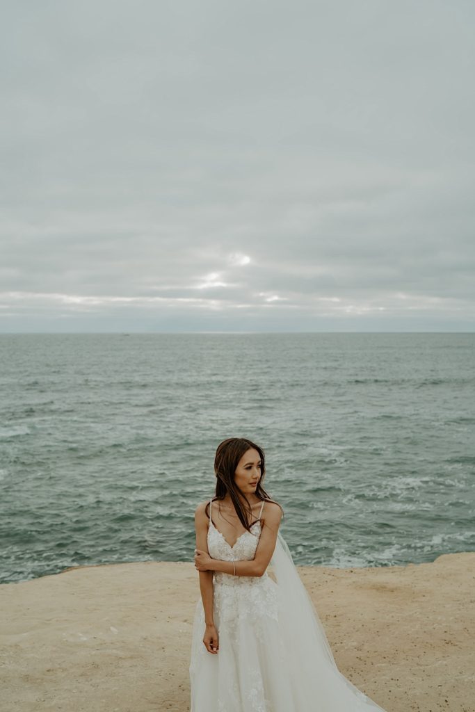 Portrait of Bride standing in front of the open water