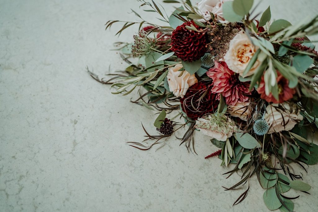 A bouquet of flowers on a marble countertop