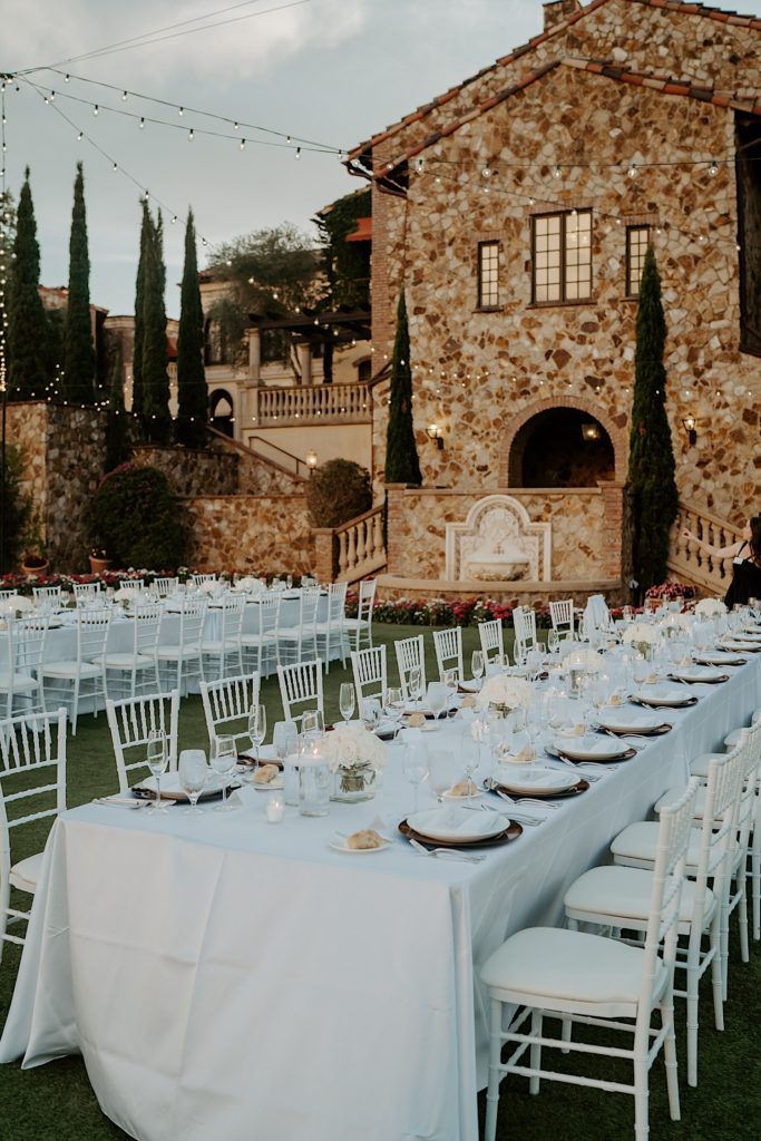 The outdoor reception space of Bella Collina in Florida with tables set for an intimate wedding reception.