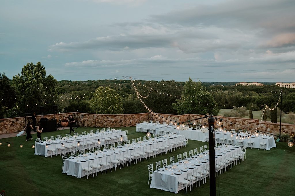The outdoor reception space of Bella Collina in Florida with tables set for an intimate wedding reception.