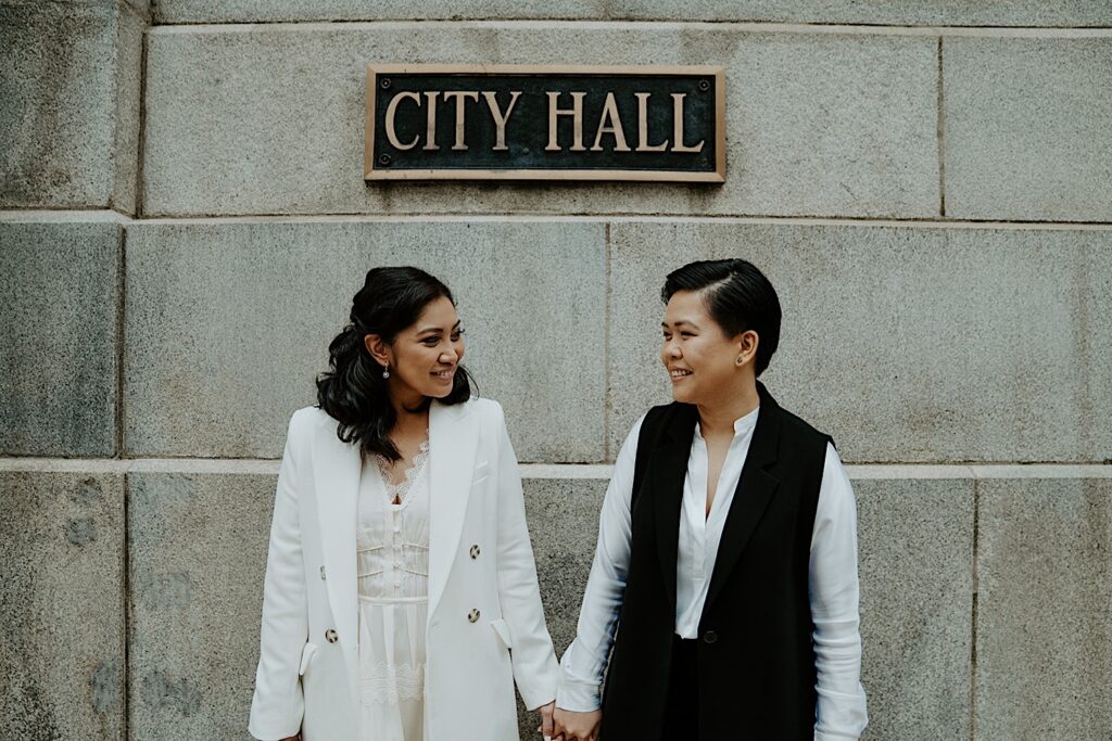 Brides stand in front of Chicago's city hall after eloping.