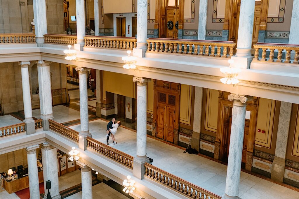 Couple dances on the second floor of Indiana Statehouse. 