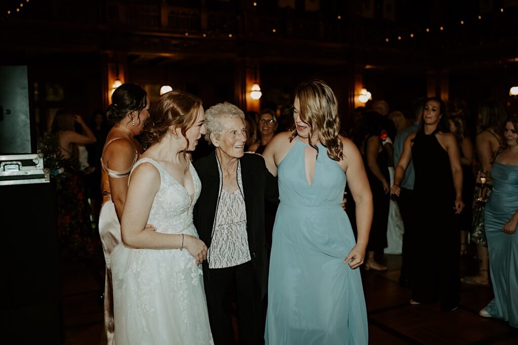 Bride gathers her grandmother and friend for a picture by Midwest Wedding photographer. 