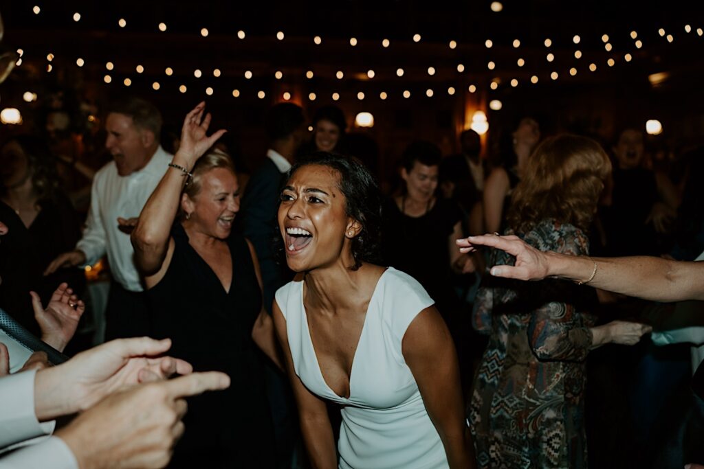 Bride sings during wedding reception in Indianapolis. 